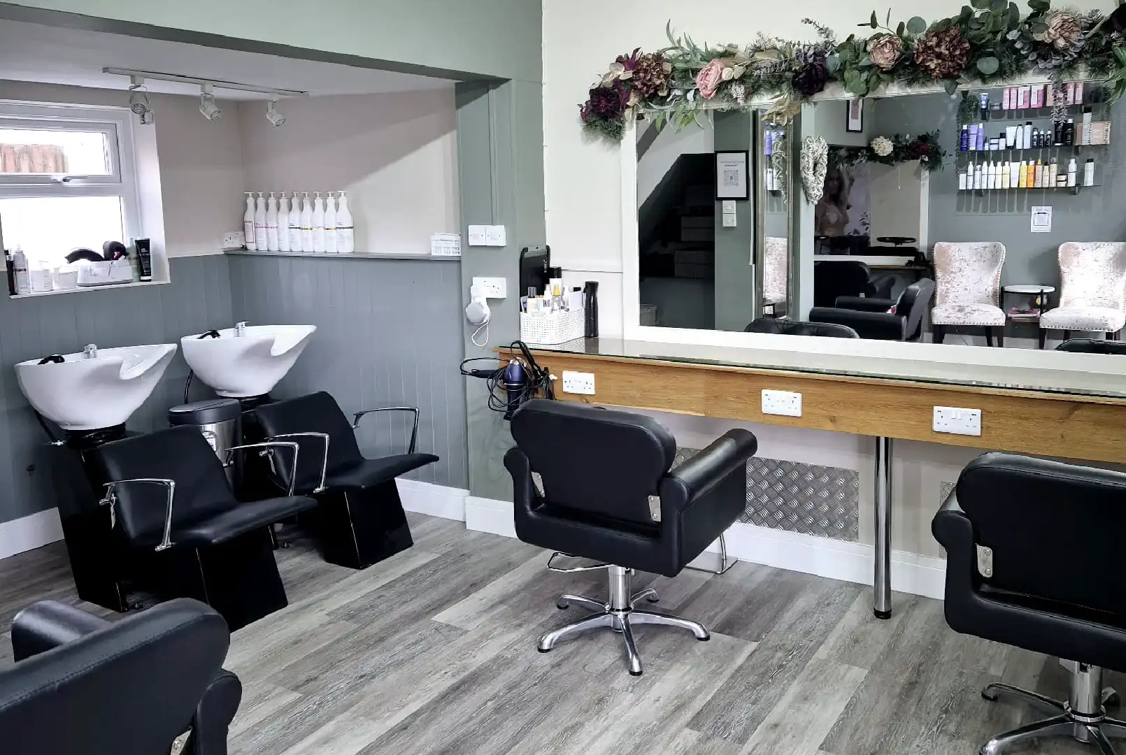 A well-lit interior of a hair salon, namely Affinity Hair Design